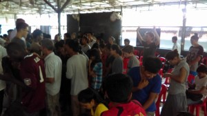 Sam praying with/for people going into the region.